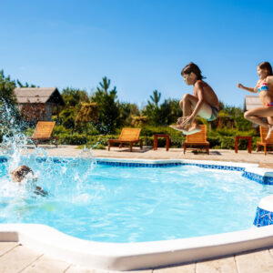 cheerful-children-rejoicing-jumping-swimming-in-pool