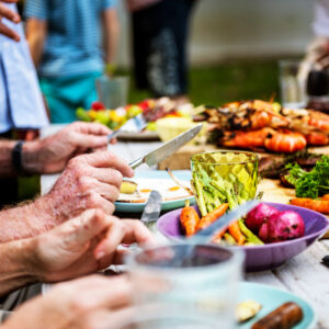 closeup-of-diverse-people-enjoying-barbecue-party-together